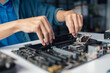 © Charlie's - Male IT Technician Repairing Computer Hardware and Troubleshooting Electronic Components for Modern Technology Maintenance Services