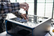 © Charlie's - Male Computer Technician Repairing Hardware Components and Providing Professional IT Maintenance Service in Technology Workshop.