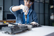 © Charlie's - Male Computer Technician Repairing Hardware Components and Providing Professional IT Maintenance Service in Technology Workshop.