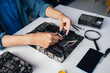 © Charlie's - Male Computer Technician Repairing Hardware Components and Providing Professional IT Maintenance Service in Technology Workshop.