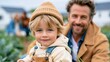 © Pinklife - A heartwarming moment of a child with bright blue eyes and a playful beanie sitting on a farm, creating a lovely bond with their father, encapsulating joy and family love.