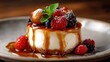 © svastix - This delectable dessert features a creamy cheesecake adorned with a luscious caramel drizzle and an assortment of fresh berries, promising a delightful taste experience.