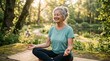 © Bejo - Senior woman meditating in nature, yoga outdoors, peaceful park setting, sunny day.