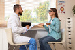 © Pixel-Shot - Eye exam and vision care, optometrist consulting with a patient in a clinic office for vision testing and prescription glasses consultation
