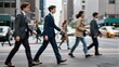 © joeycheung - Busy urban street with men in suits crossing, city buildings blurred in background.