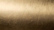 © cokninghap - Scratched brushed brass metal texture plate with glowing reflection and empty copy space