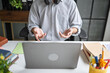 © Charlie's - Asian Male Online Tutor Teaching Students Through Laptop for Digital Education Distance Learning and Modern Technology.