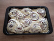 © Marek - Homemade cinnamon buns covered with rich creamy frosting in a baking pan, featuring classic spiral shapes and soft sweet dough, ideal for bakery, dessert, breakfast and home baking concepts.