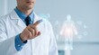 © Md. Mahfuzur Rahman - Male doctor interacting with futuristic AI medical holographic interface for human health analysis