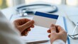 © Generative AI - Doctor holding medical insurance card over desk