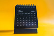 © Steppe-Walker - Desktop calendar showing October 2026 on yellow background, time management and planning concept
