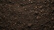 © Panpatsa - Fertile soil with rich texture as a gardening season background.