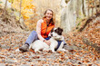 © Melinda Nagy - happy white dog with owner in autumn forest