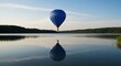 © TITISCAHYA - Serene blue hot air balloon floats over calm lake, reflecting perfectly in still water; tranquil landscape