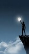 © Dipsky - Silhouette silhouette of a man reaching hand towards a bright full moon standing on a high cliff