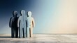 © Imanza - Three stylized wooden human figures in blue gradient tones representing teamwork and community collaboration in professional settings.