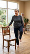 © 123sasha - Senior Woman Practicing Balance Exercise With Chair