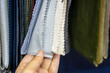 © Zhaorui - Various Fabric Swatches Held by a Hand for Selection