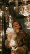 © Ackbara Studio - Elegant woman spraying scent in a warm golden room, surrounded by mist and glow, creating chic beauty scene with calm and sensual mood and shine soft
