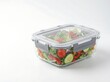 © FrameBloom Studio - Glass food container with fresh salad inside for healthy lunch meal prep. spill proof container
