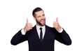 © deagreez - Portrait of excited satisfied cunning cheerful confident curious positive delightful handsome creative active laughing freelancer demonstrating thumbs-up pointing up isolated on gray background shirt