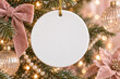 © Iryna - Blank round ceramic ornament on a Christmas tree with blush and champagne decorations, ideal for festive design mockups and personalized holiday branding.