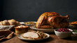 © arip - Traditional Thanksgiving dinner featuring a golden roasted turkey and festive side dishes on a rustic wooden table.