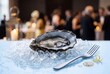 © AdPremium - Fresh Raw Oyster Served on Crushed Ice with Seafood Fork at a Luxury Gala Event or Cocktail Party