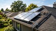 © answra - Residential rooftop solar water heating system installed on a house roof with plumbing pipes and trees in background