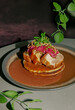 © Lilit Lysa/Stocksy - Roasted Pork Meat with fried potato pancakes, fritters, brown Sause