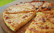 © jobi_pro - Closeup of Freshly Baked Khachapuri Imeruli or Cheese-filled Georgian Flatbread
