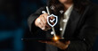 © InfiniteFlow - A business professional interacts with a digital tablet showcasing symbols of security, technology, and connectivity, illustrating modern data management practices. Nascent