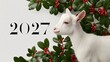 © KARINA - White goat rests beside holly branches with red berries. Year 2027 marked in bold, elegant font. Serene and peaceful animal in festive holiday setting. Ideal for New Year, Christmas