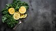 © Hasan - Fresh kale leaves and juicy lemon slices, healthy food flat lay on dark stone background
