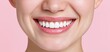 © ckybe - A joyful young woman displays bright, smooth teeth, highlighting healthy dental care and confident smiles.