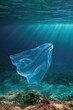 © Iryna - Translucent plastic bag floating above coral seafloor in sunlit ocean scene to illustrate pollution for environmental poster and background use
