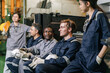 © Quality Stock Arts - Diverse factory engineering team sitting relax talking and discussing work in manufacturing plant
