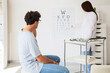 © Pixel-Shot - Eye exam and vision test, patient having eyesight checked by optometrist in clinic with eye chart and glasses for medical diagnosis and health care