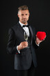 © be free - Love romantic gift. Rich man in tuxedo with champagne. Valentines sale. Rich man celebrate valentine day. Man with heart. Happy valentines day. Life goals. Man with love isolated on black