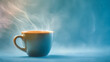 © Daria - Steaming hot cup of coffee on a smooth surface with soft glowing background evoking warmth and cozy morning ambiance in blue and orange tones