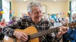 © Len_mik - Senior man playing acoustic guitar at community event. Smiling elderly musician performing for peers. International Day of Older Persons celebration