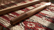 © lnsu - Close view of taut fibers and a smooth wooden shuttle