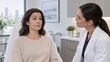 © Makino80 - Aesthetic Clinician Assessing Forehead Expression Lines as Woman Raises Eyebrows During Consultation
