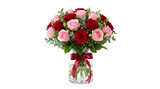 Beautiful bouquet of red and pink roses in a glass vase isolated on transparent background