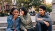 © Oleg - Smiling teenagers chatting on outdoor steps in a city park. Connectioneering and friendship in a diverse urban hangout with casual street style.