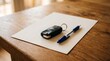 © Awan creative  - Car keys and pen on blank paper and agreement on wooden desk, concept of car sale, purchase contract and signing deal