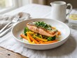 © create story - Panseared salmon fillet served with steamed broccoli, yellow bell pepper strips, and carrots, garnished with fresh herbs and a light creamy sauce on a plate