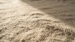 © jasminumsambac - Close up of textured fabric with soft light casting shadows across the surface.