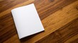 © ThreadCraft Studio - Blank white brochure booklet mockup lying on warm textured wooden surface