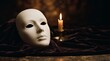 © Thumbs - White theatrical mask resting on dark velvet fabric with candle light
